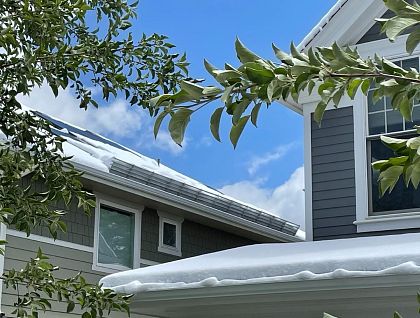 Drift Solar with Ice Screen retaining snow - On Point Contracting